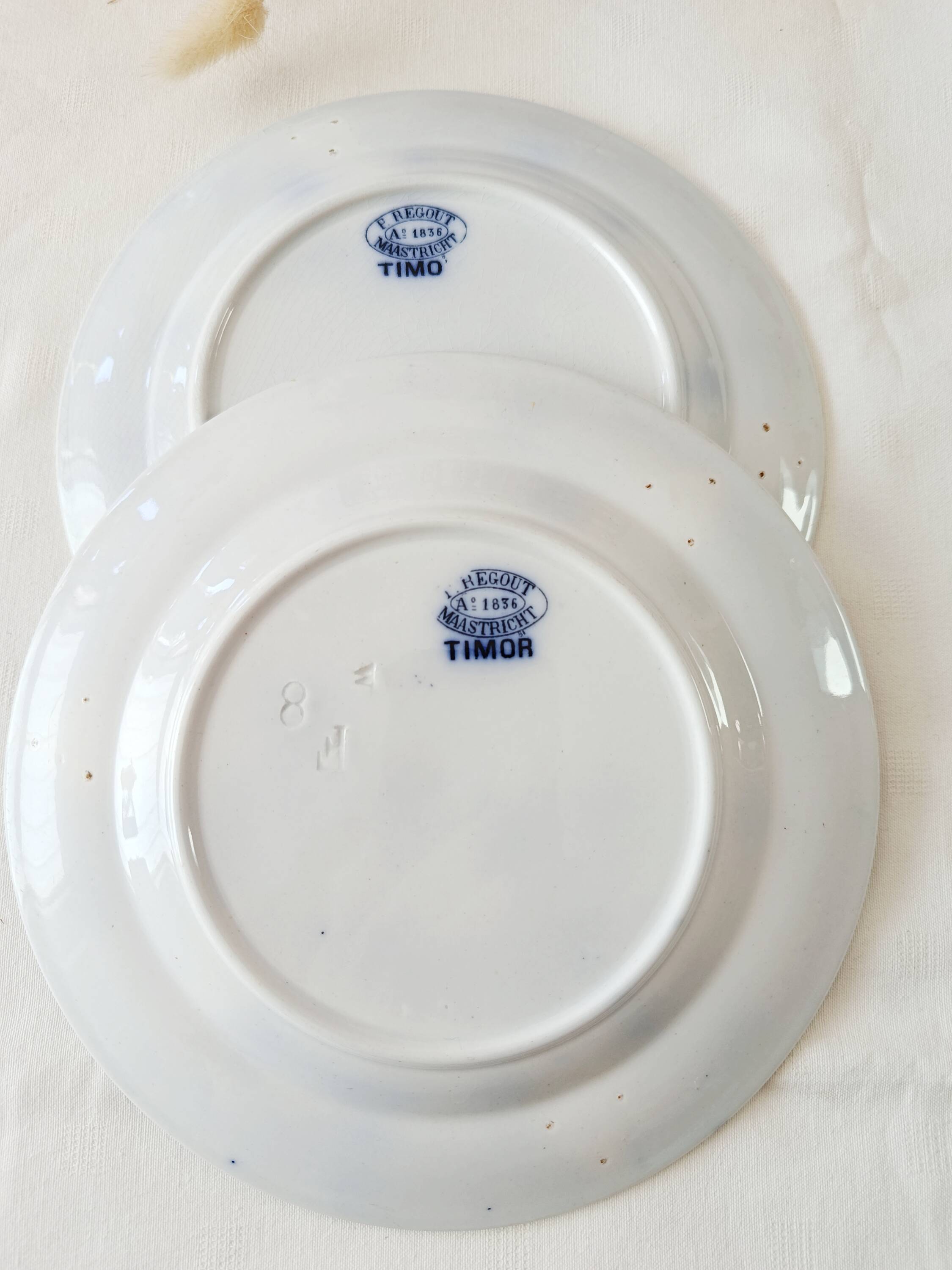 Set of 2 flat plates Petrus Regout, Timor