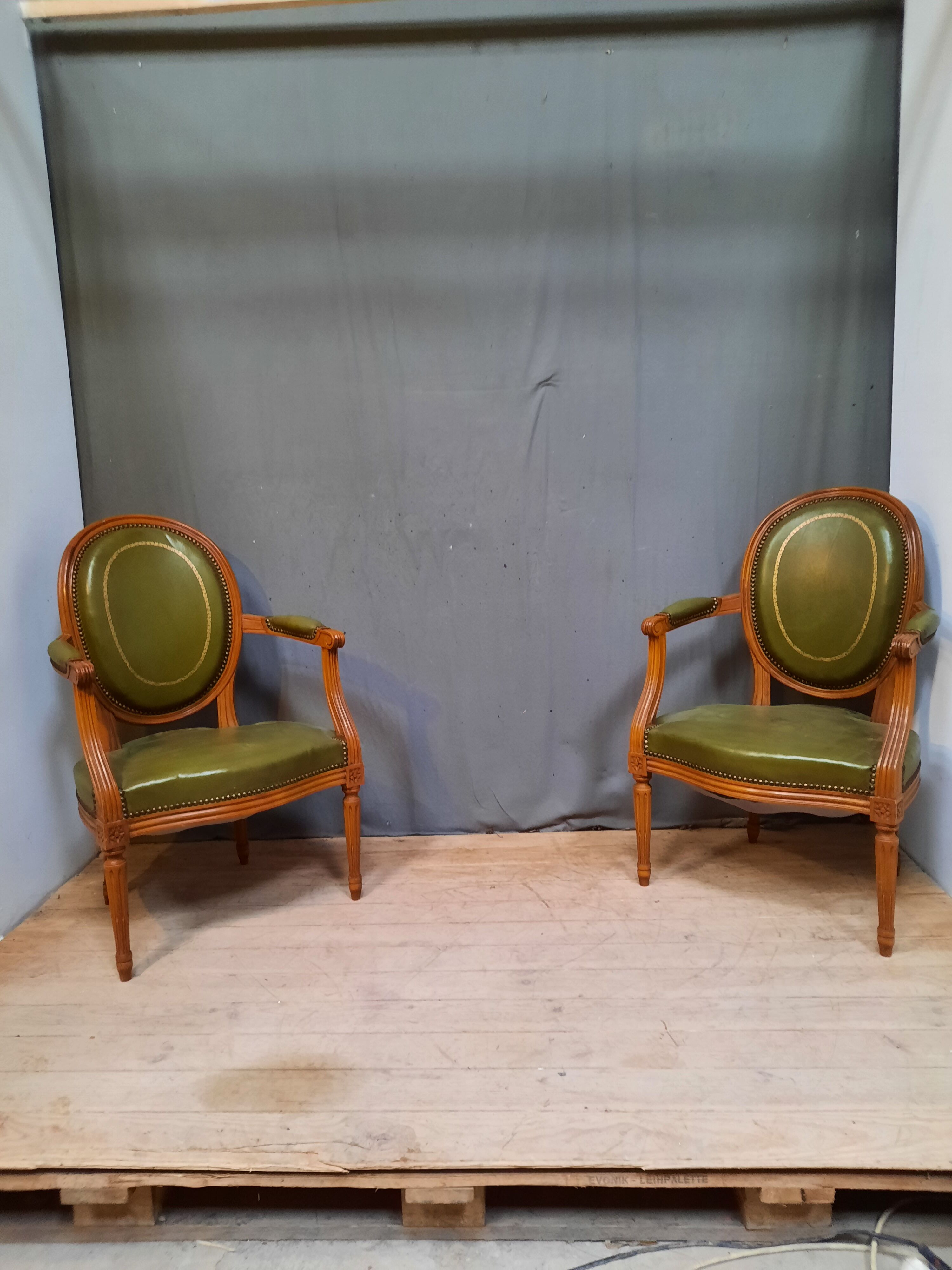 Pair of Louis XVI style leather armchairs