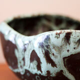 Empty pocket in black ceramic with green drip
