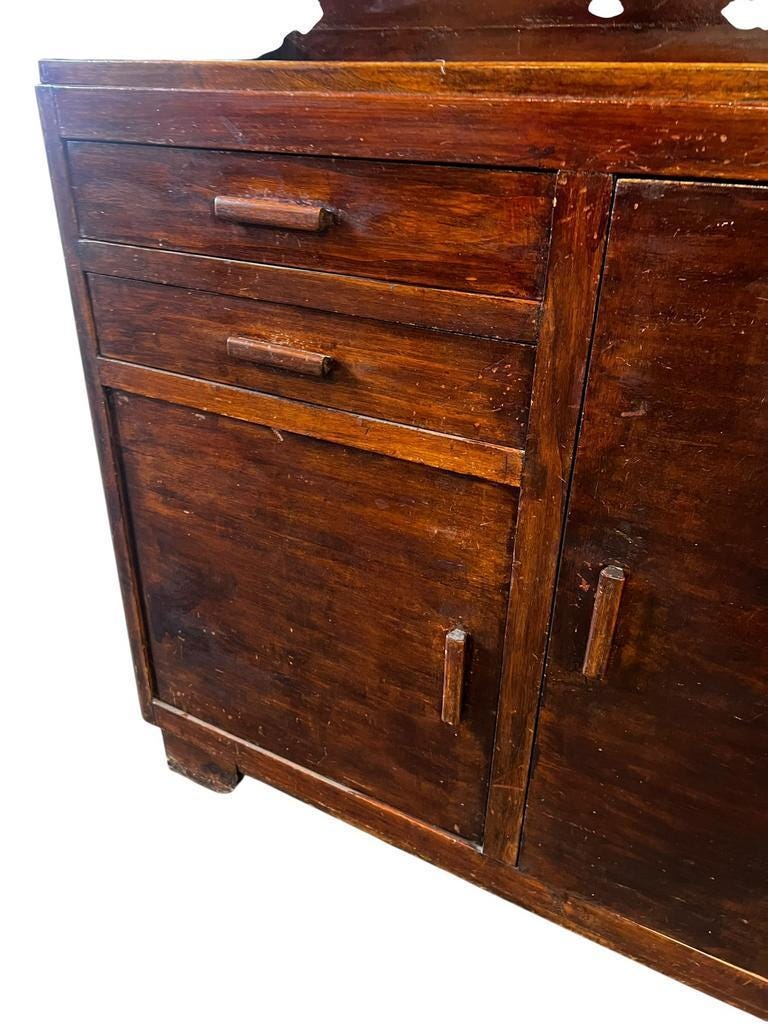 Vintage wooden display cabinet with yellow glass.