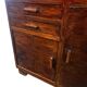 Vintage wooden display cabinet with yellow glass.