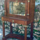 A small piece of Bonheur du jour with detached columns in Empire-era mahogany.