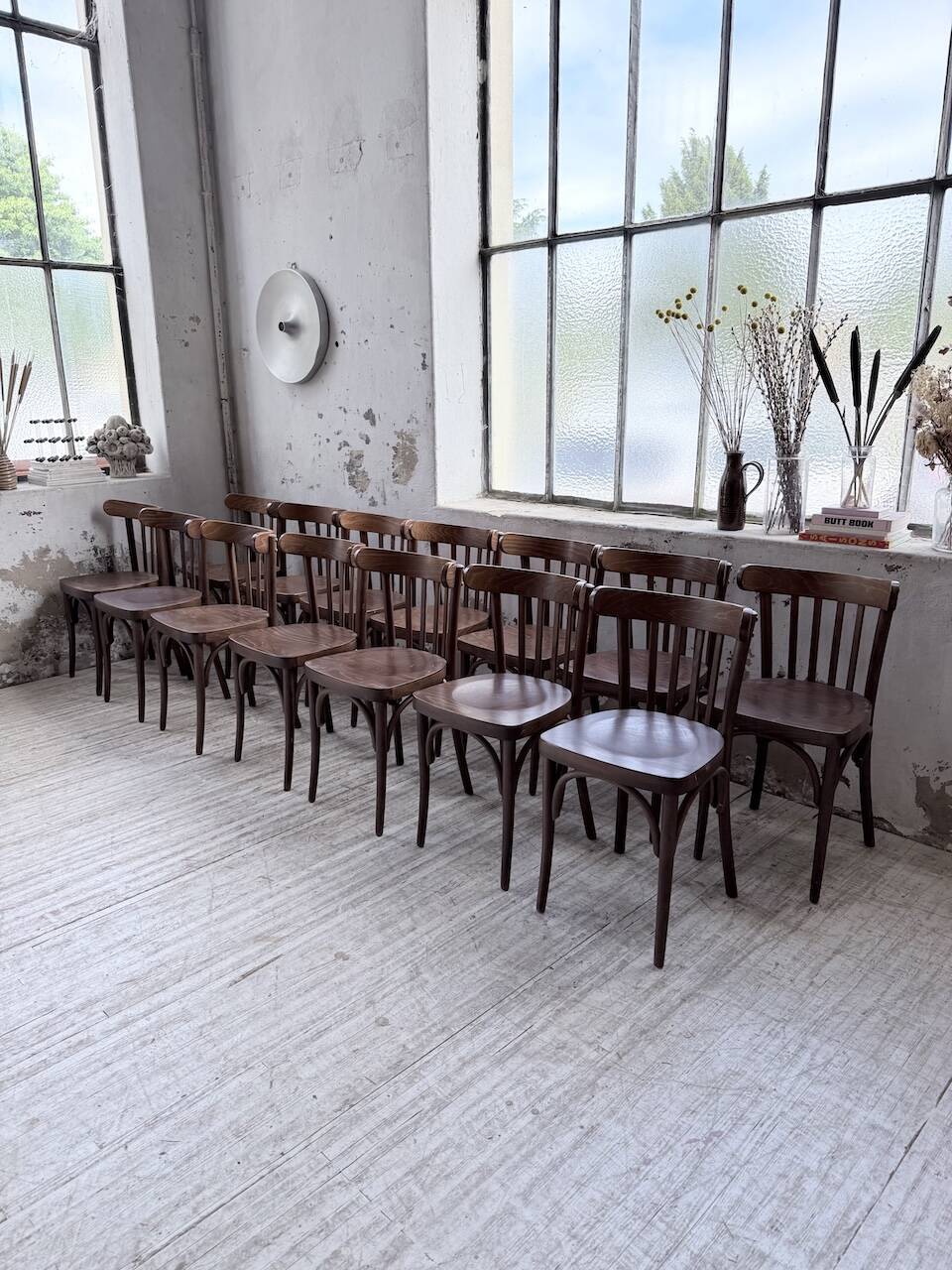 Set of 14 walnut bistro chairs.