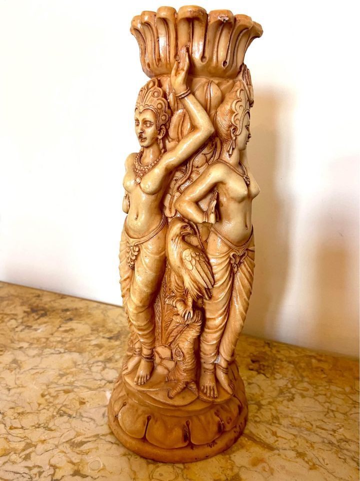 Two ancient Indonesian candlesticks.