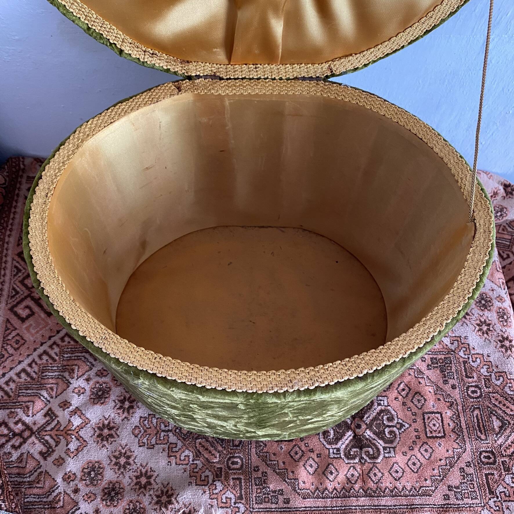 Green velvet storage pouffe from the 1960s.