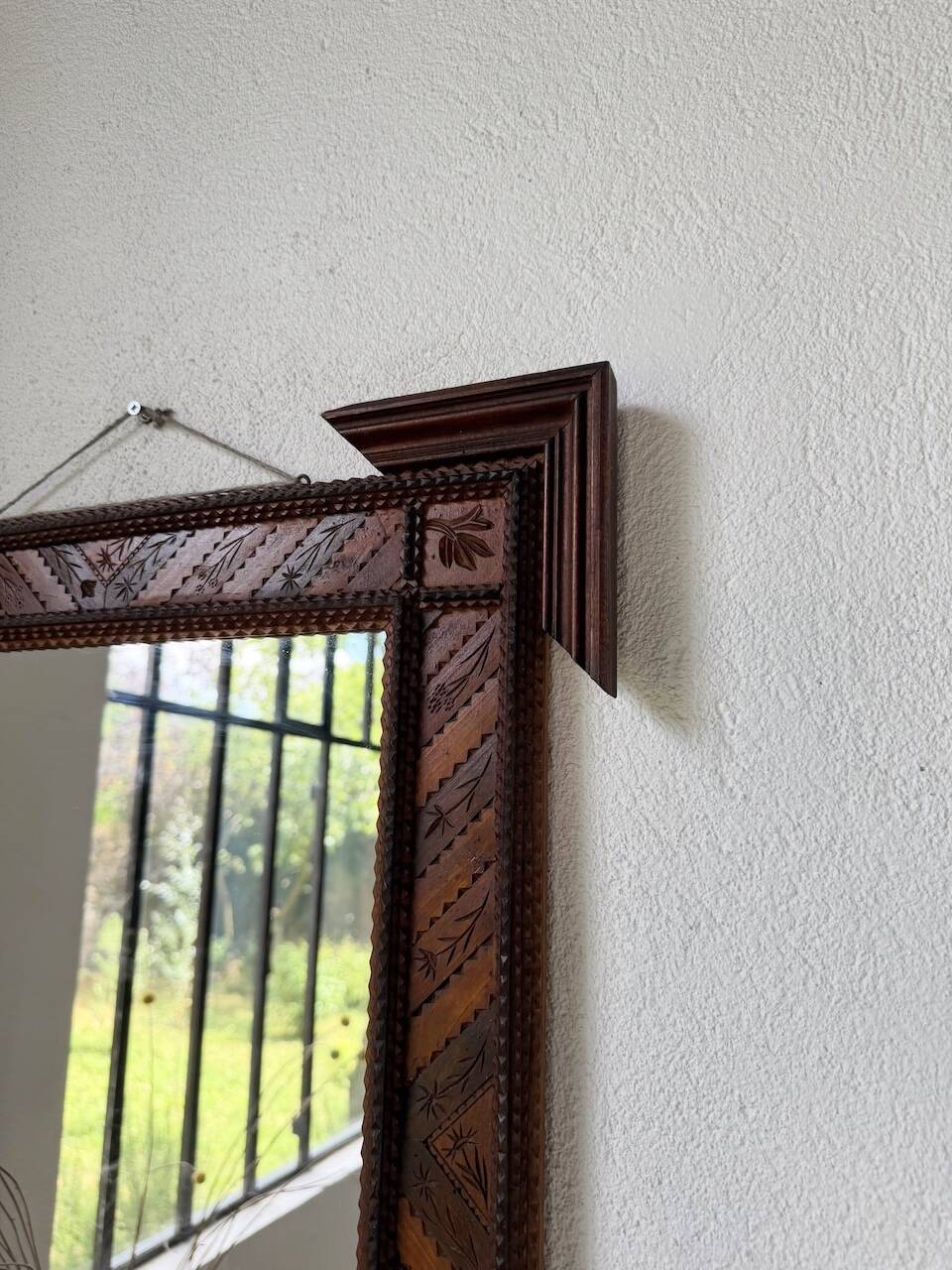 Pair of wooden mirrors in tramp art style