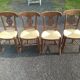 Set of four Directoire-style straw-seated chairs