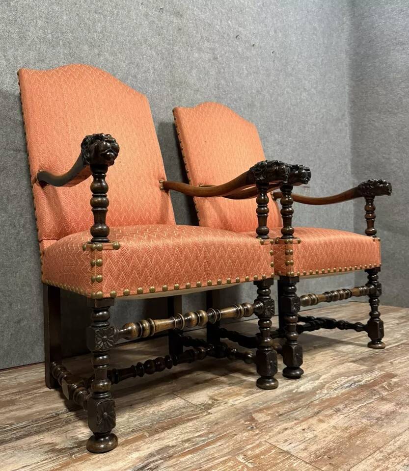 Pair of Louis XIII style armchairs in carved walnut circa 1850