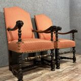 Pair of Louis XIII style armchairs in carved walnut circa 1850