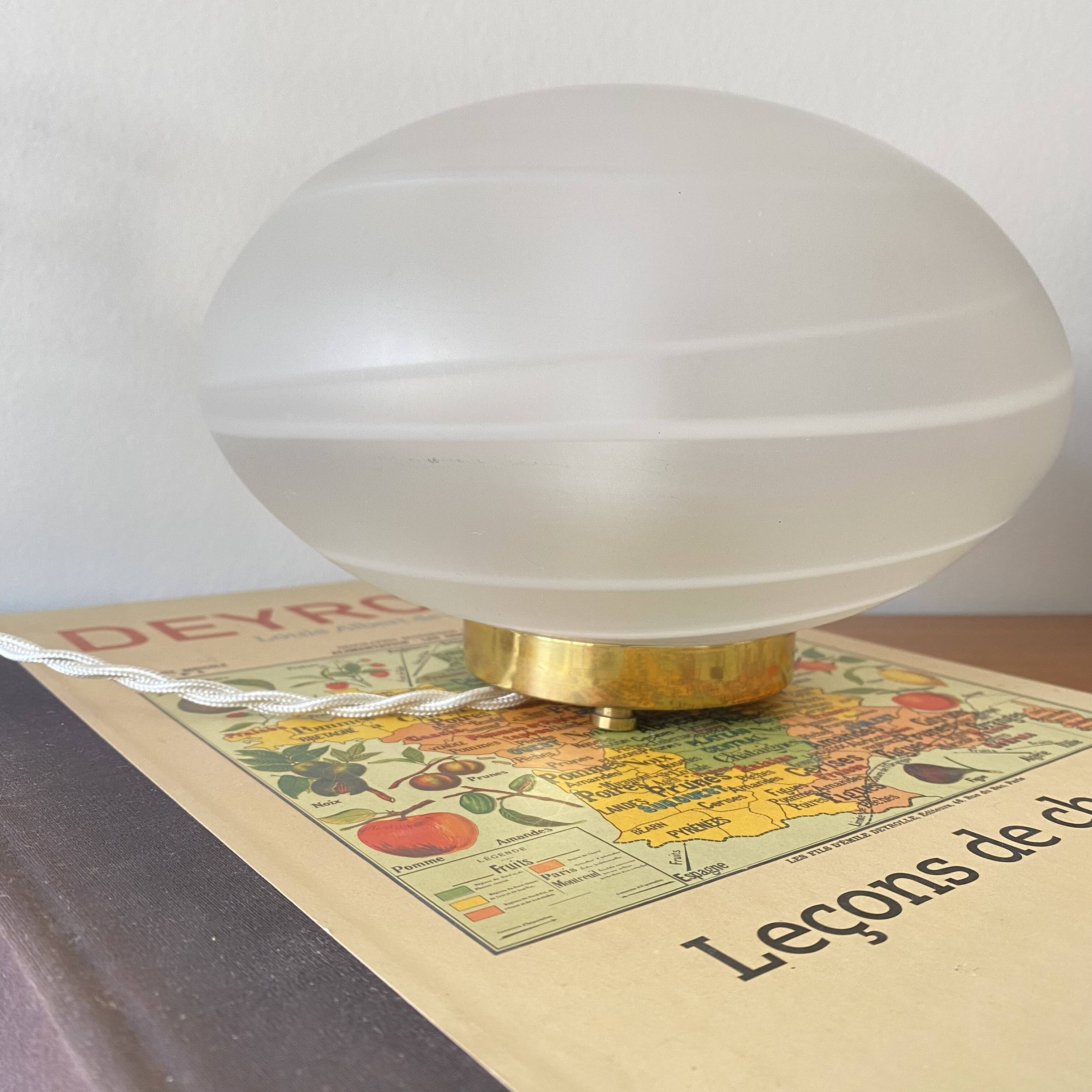Vintage desk table lamp in antique glass with a brass base.
