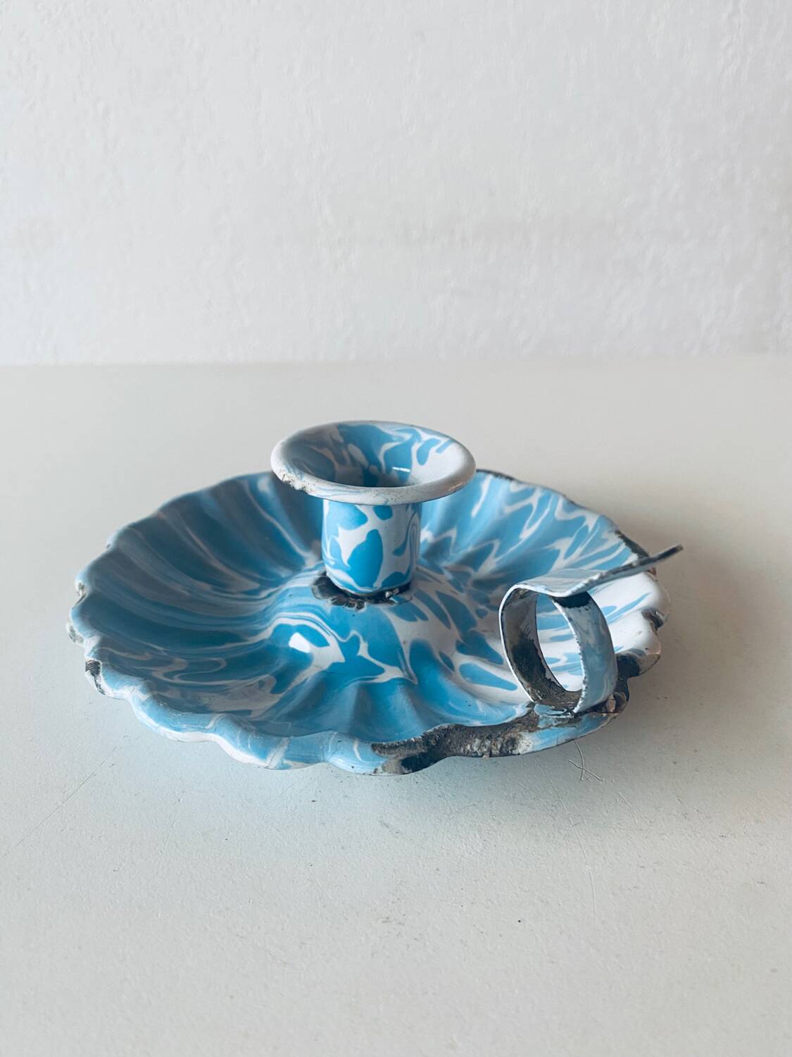 Old blue enameled metal candle holder