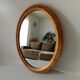 Antique oval mirror in gilded solid wood