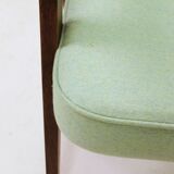 Pastel pistachio wool fabric Scandinavian armchair, oak wood.