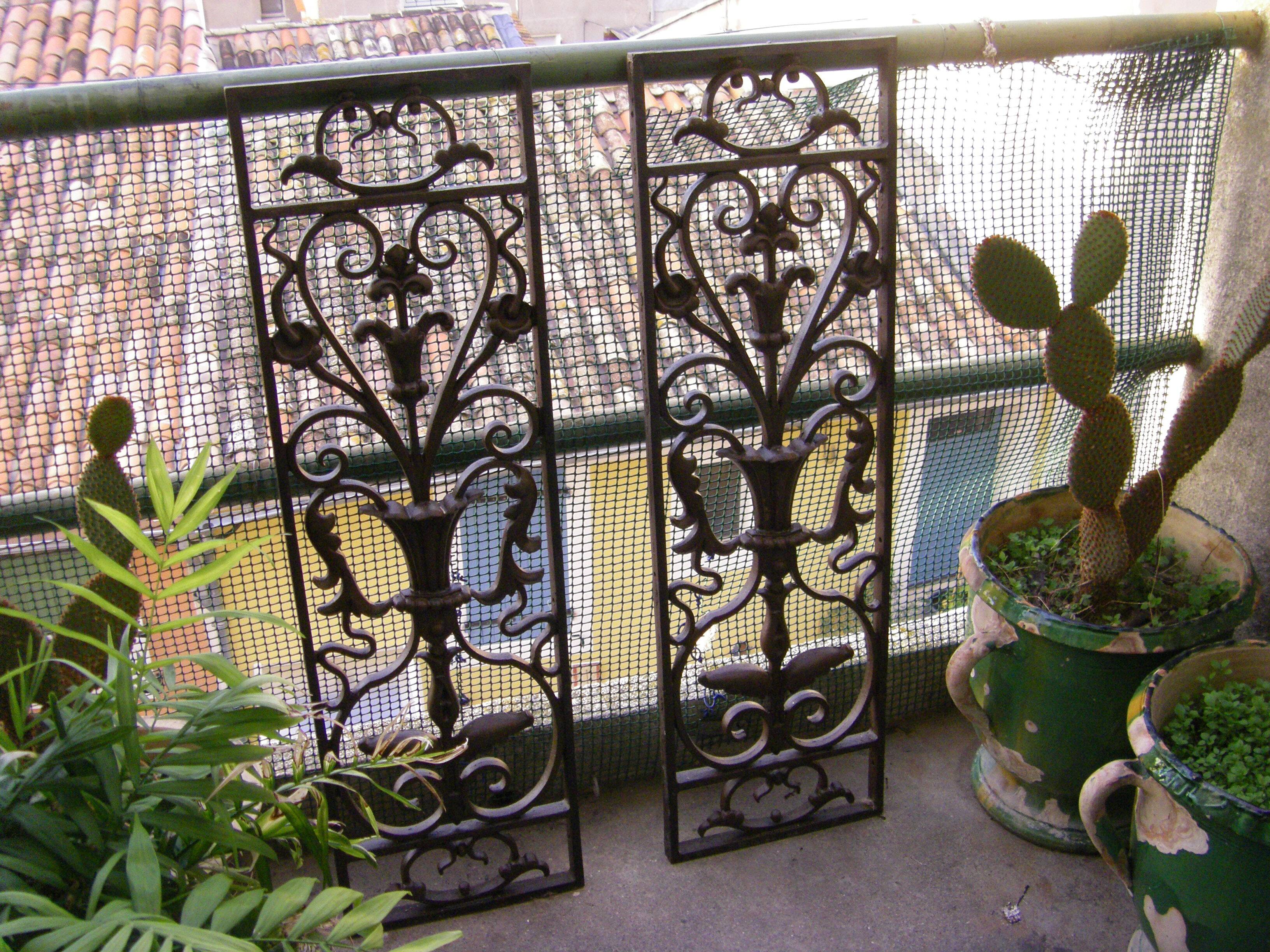 Pair of wrought iron door grilles from Dammarie