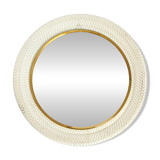 Mid Century Modern round wall mirror with a white expanded metal frame