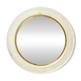 Mid Century Modern round wall mirror with a white expanded metal frame