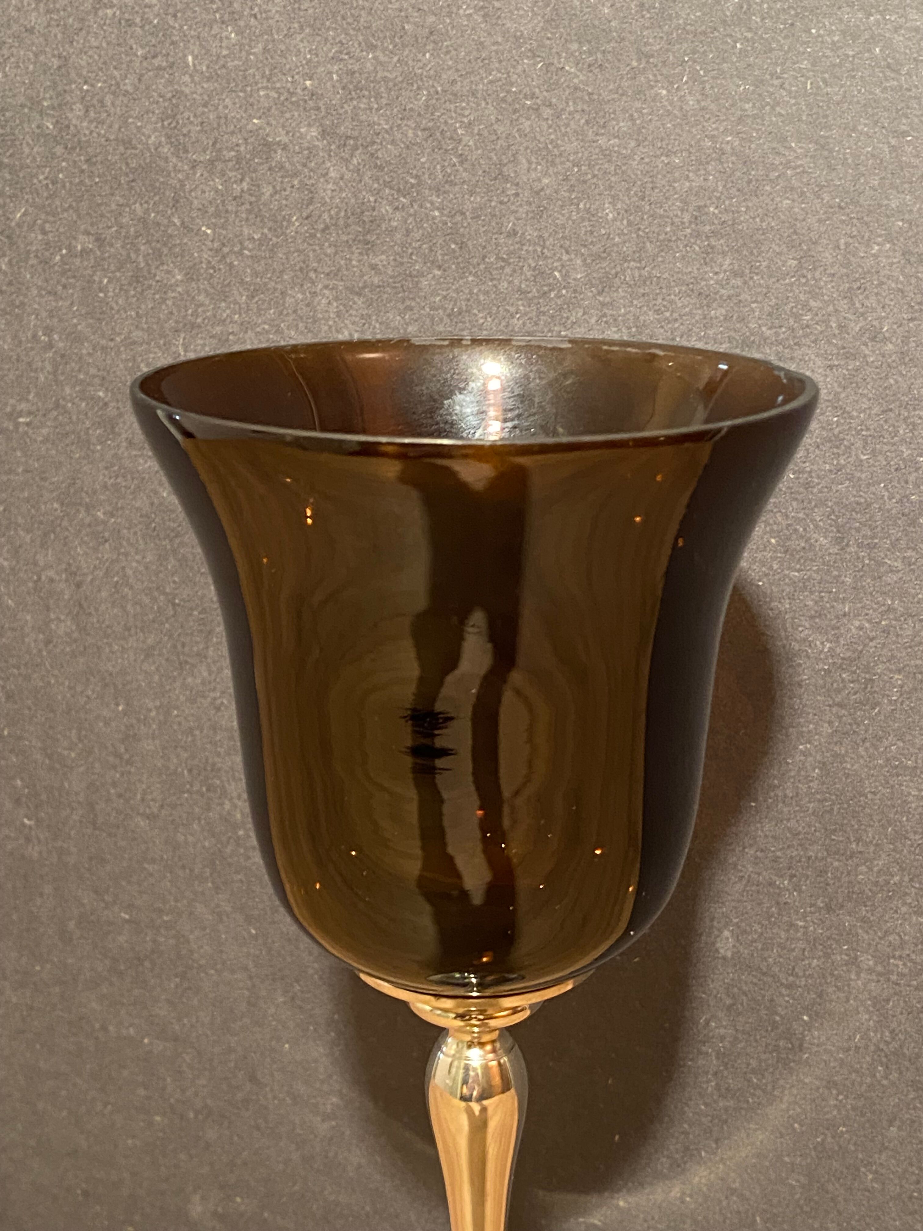 Photophore in tinted glass on high metal foot with silver patina