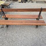 Antique double garden bench from the city of Paris in cast iron and wood