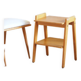 Bedside or side table with compass legs.