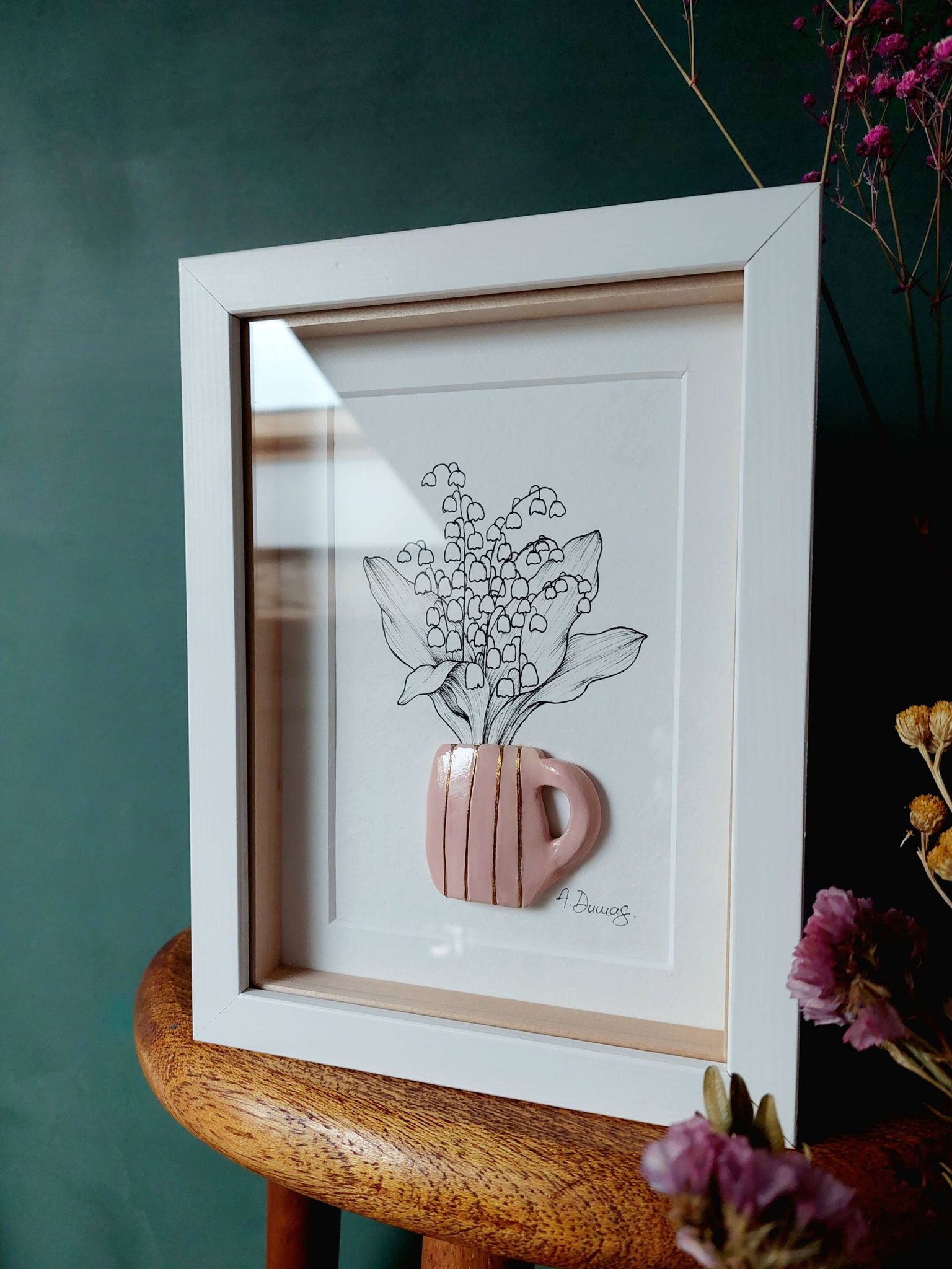 Composition of a bouquet of lily of the valley in a clay mug