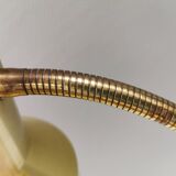 Older Swedish table lamp, estimated 1980s, in gold-colored aluminum with “bend”.