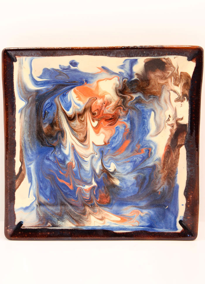 Square plate in enamelled earth with multicolored mottling