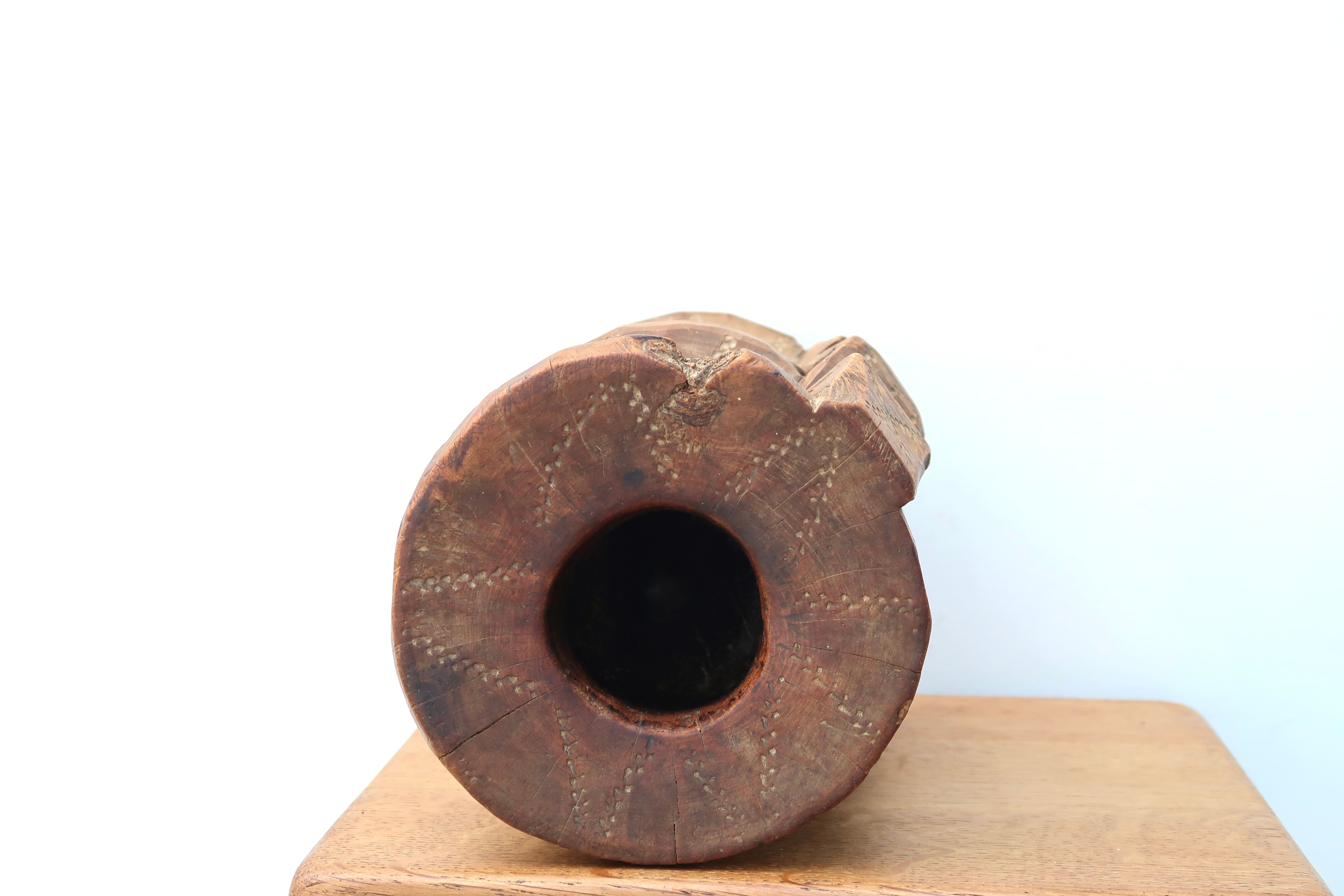 African mortar in carved wood, cast iron pestle, 70s
