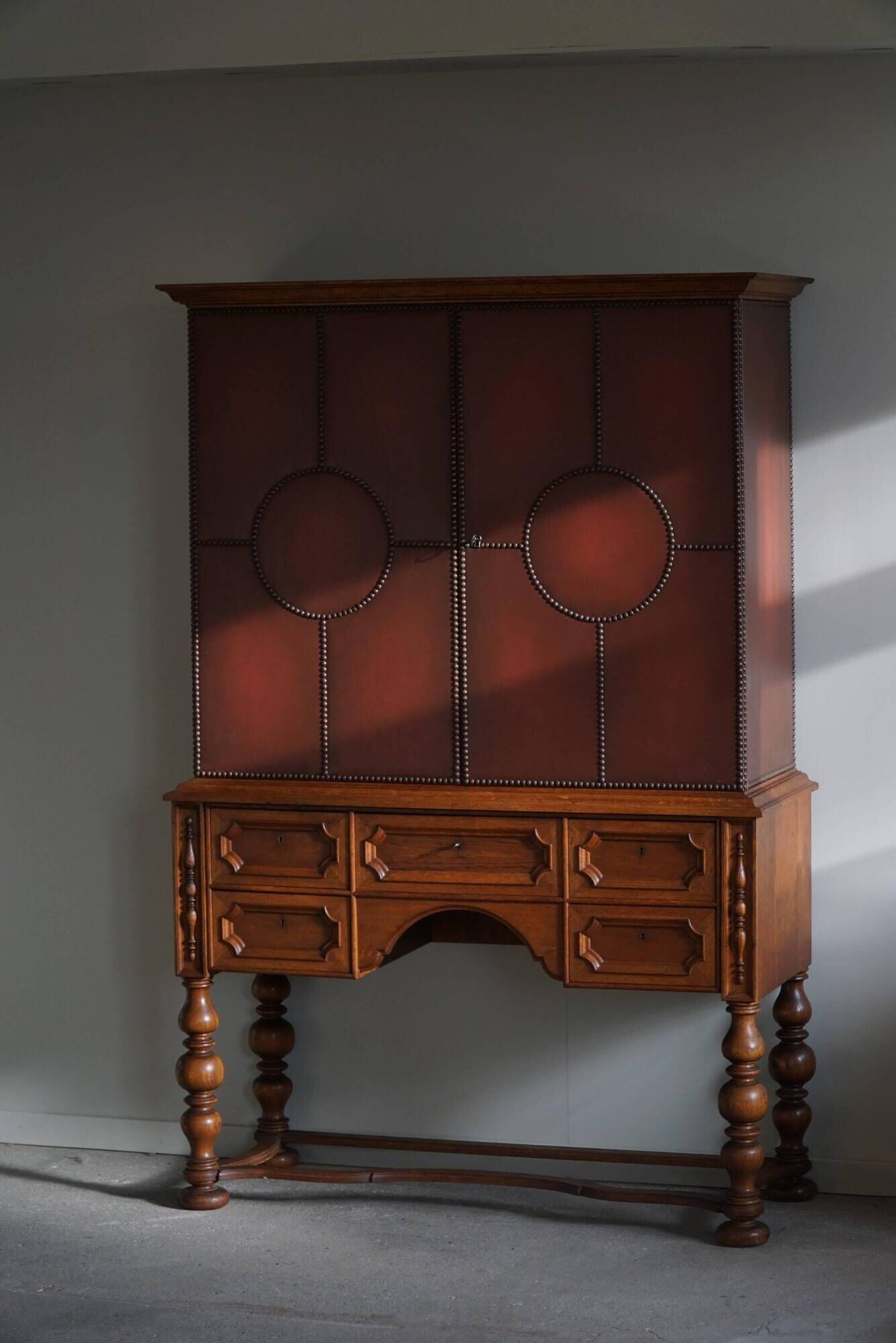 Otto Schulz, modern Swedish wardrobe in leather, oak and brass studs, 1930s.