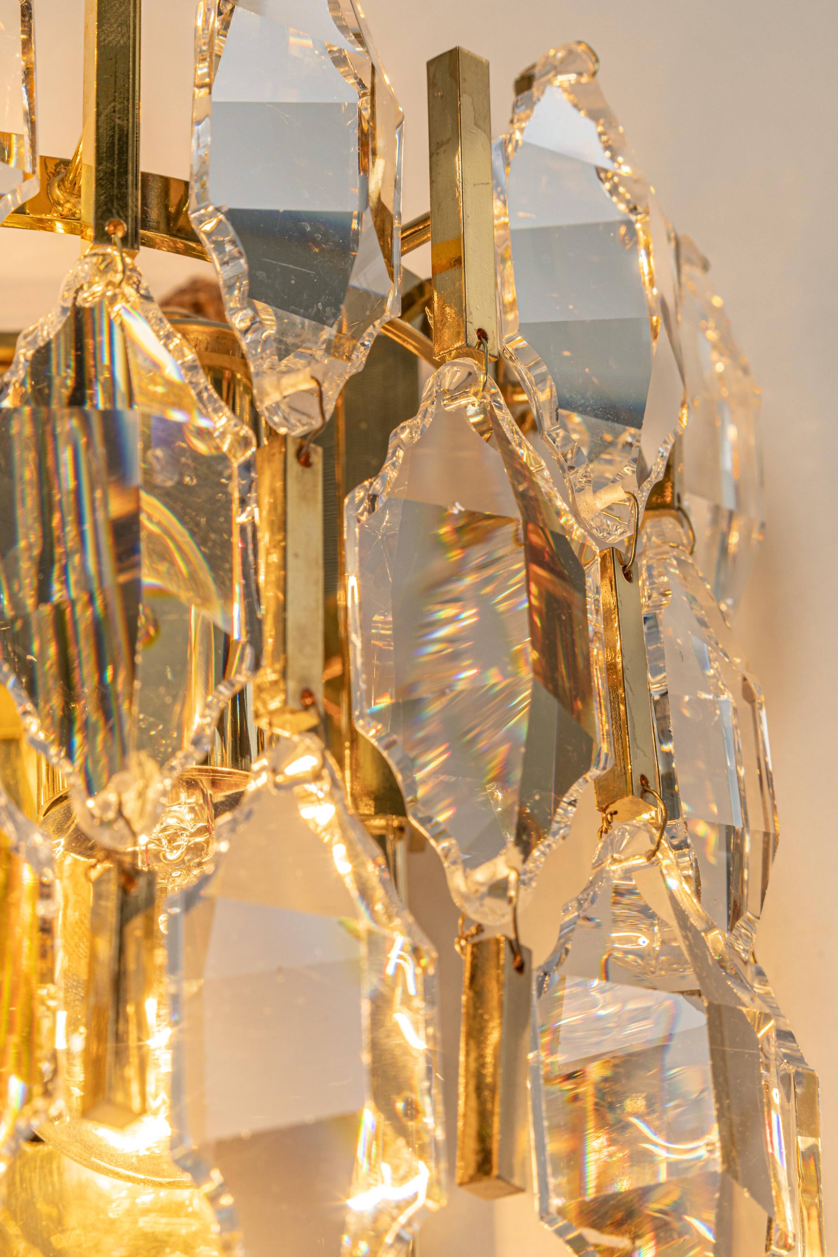 Pair of wall sconces in gilded brass and crystal by Palwa, Germany, 1970s.