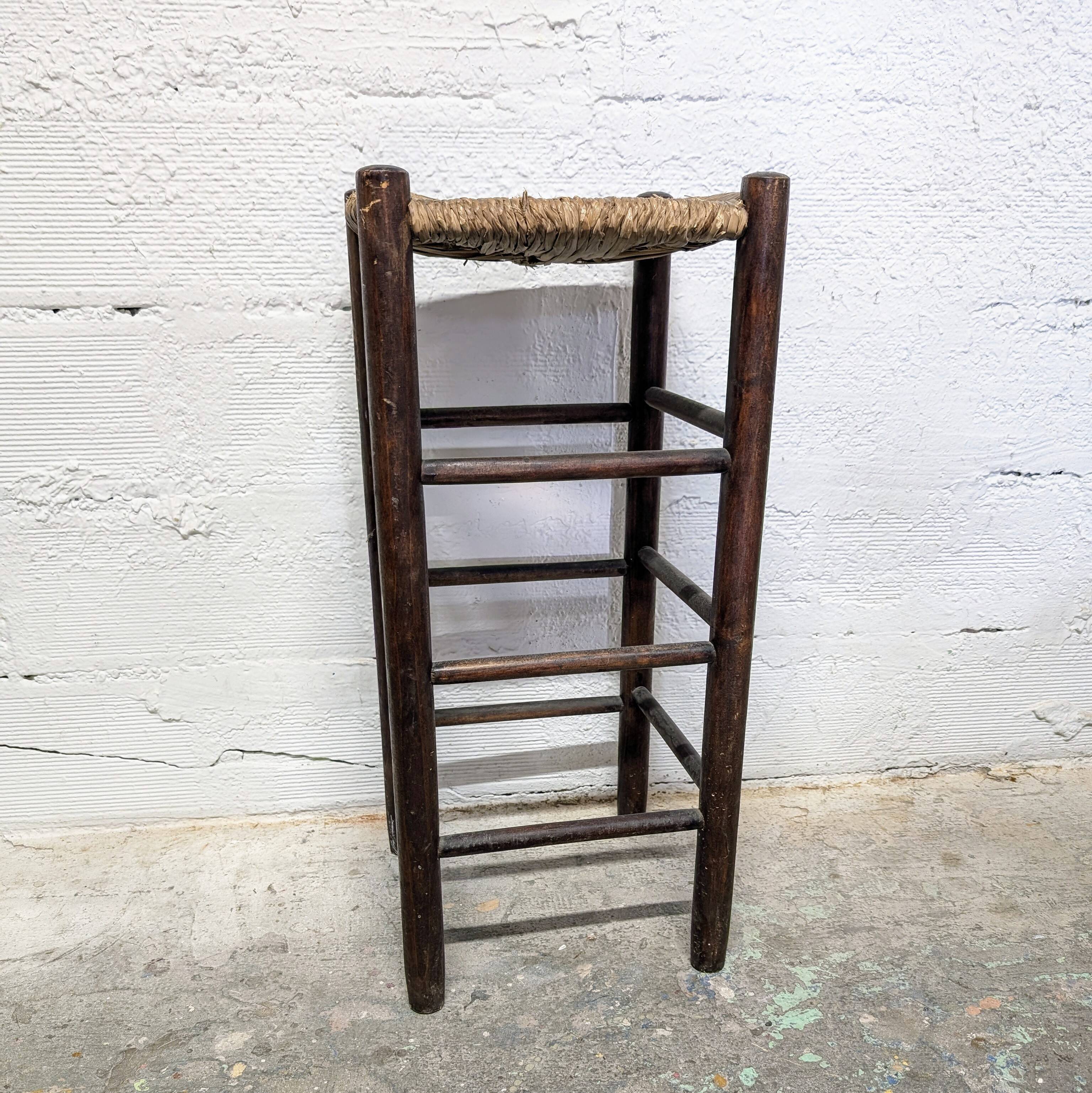 High stool made of wood and straw