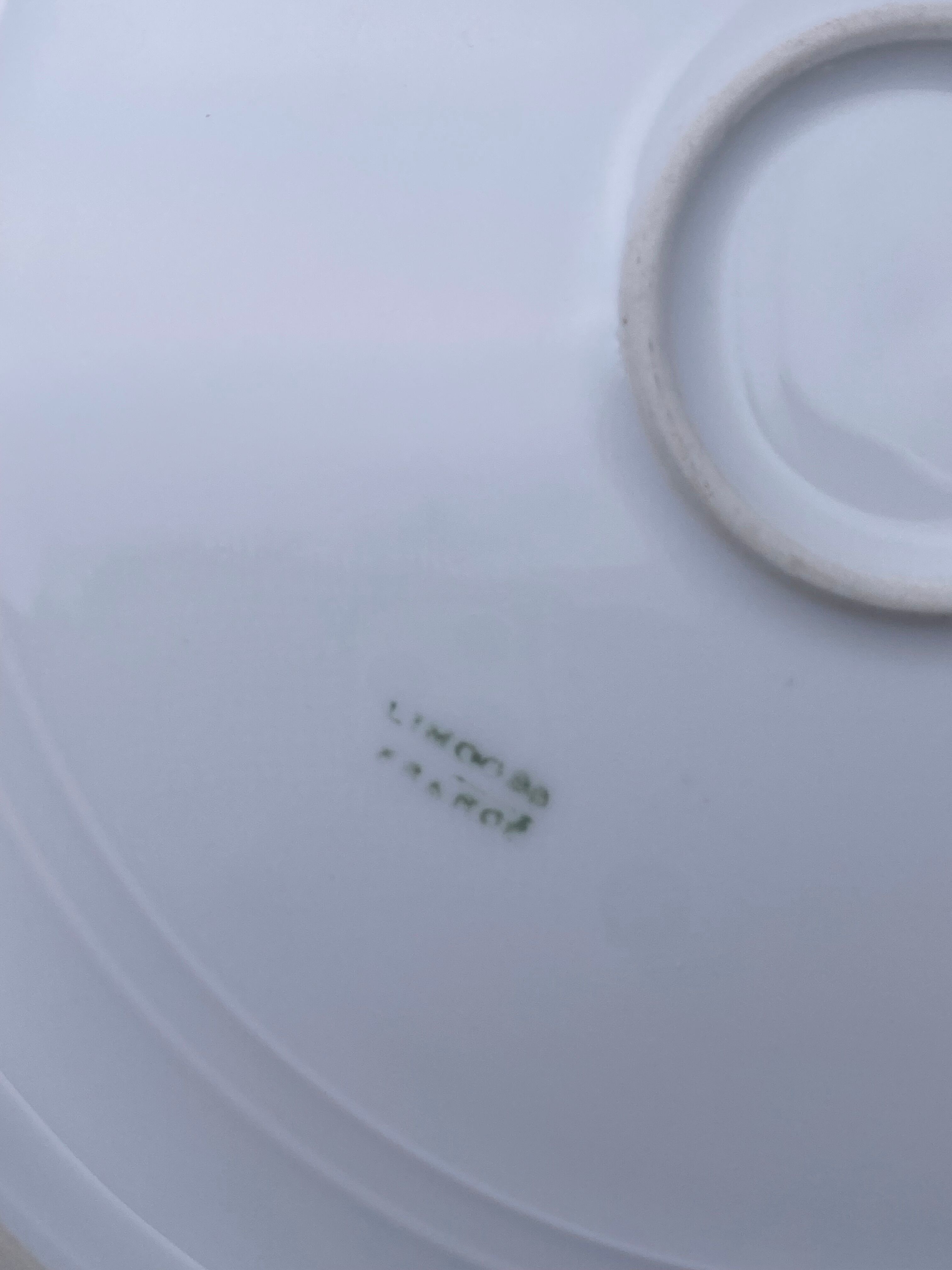 Round porcelain dish from Limoges golden tower