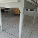 Farmhouse table with pearl gray base and raw wood top.