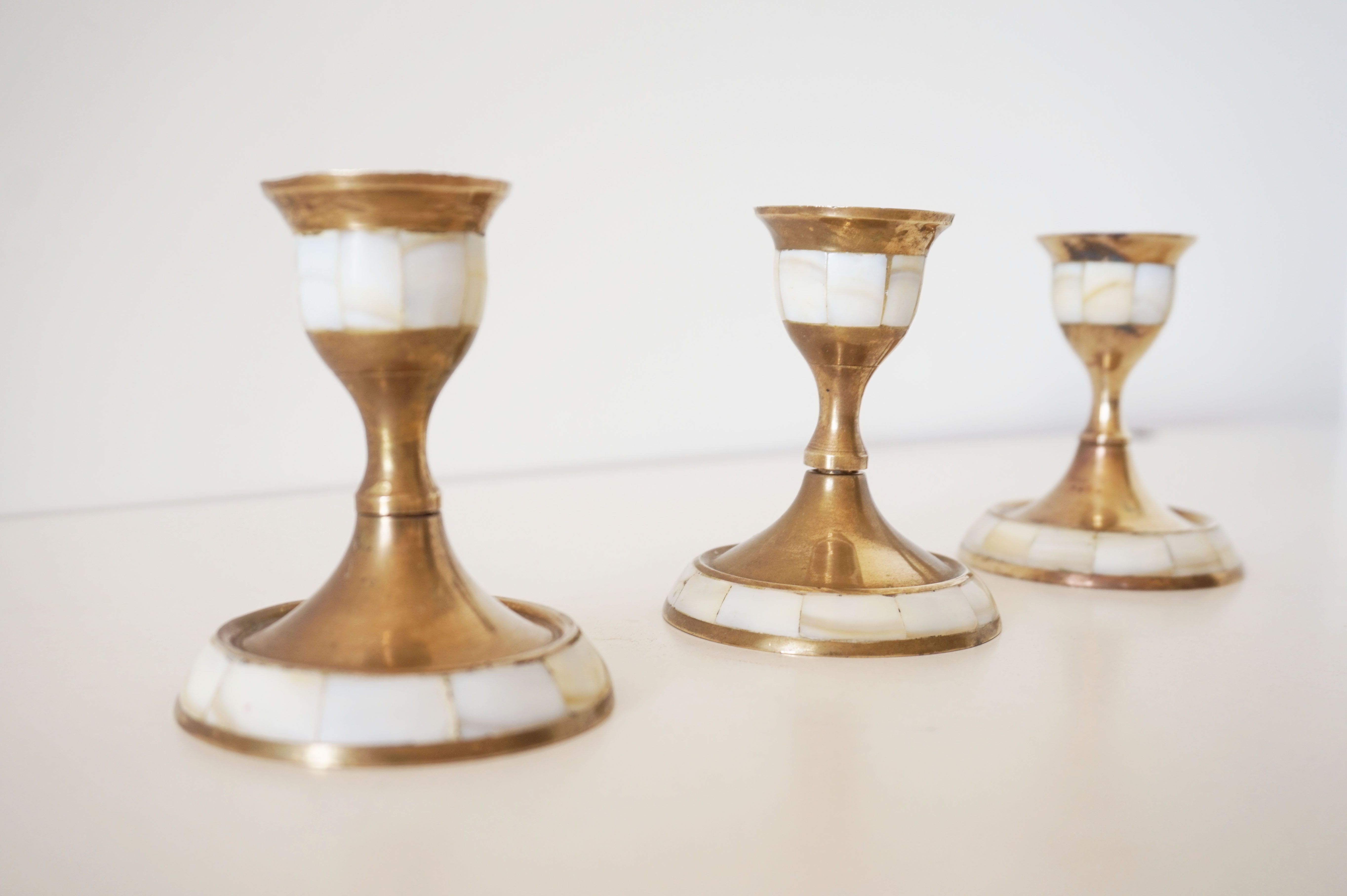 Lot of old candlesticks in brass and mother-of-pearl