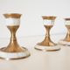 Lot of old candlesticks in brass and mother-of-pearl