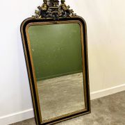 Antique 1800s black and gold mirror with cupid, France 1800s.