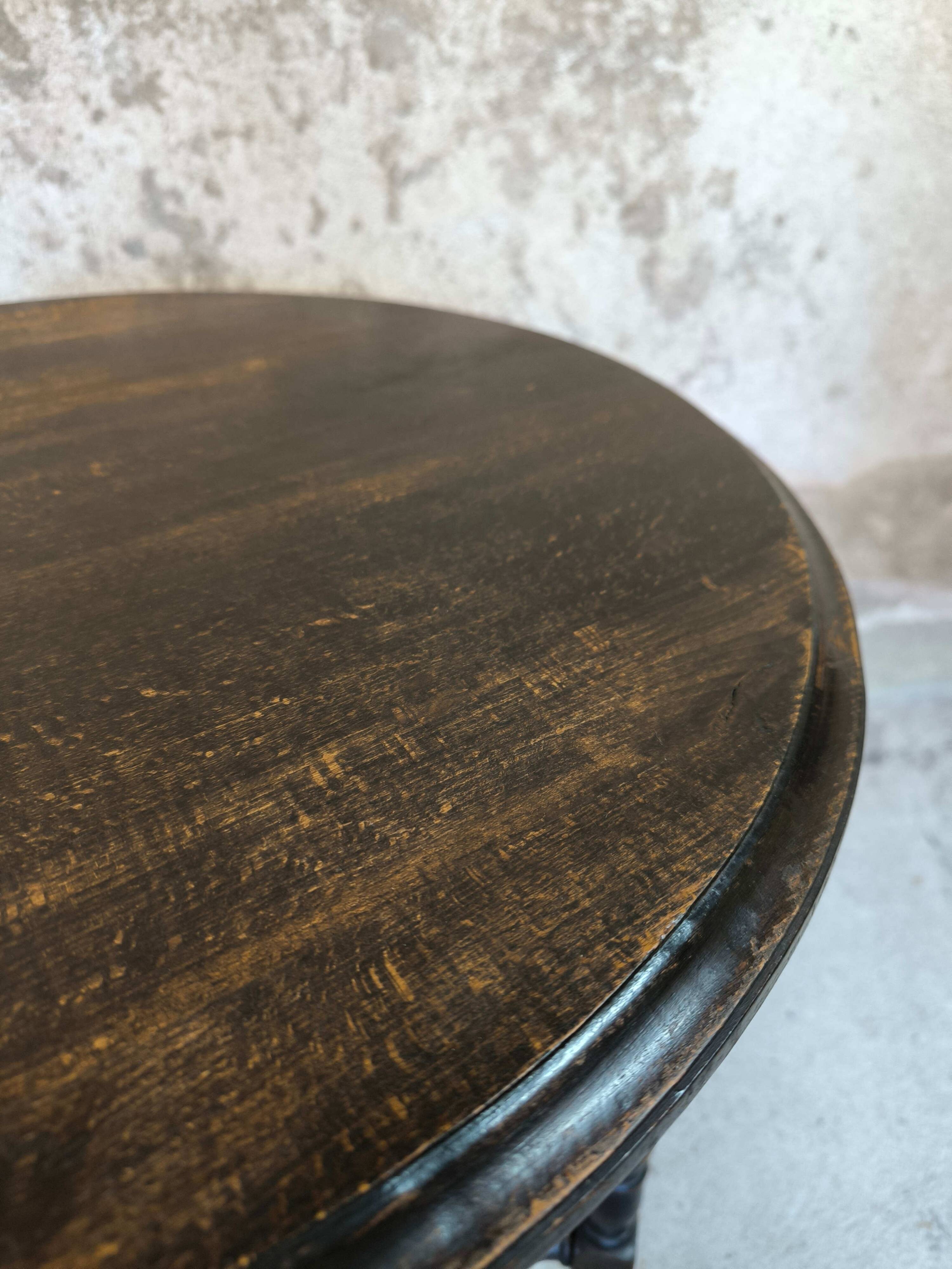 Vintage gueridon with beaded wooden legs.