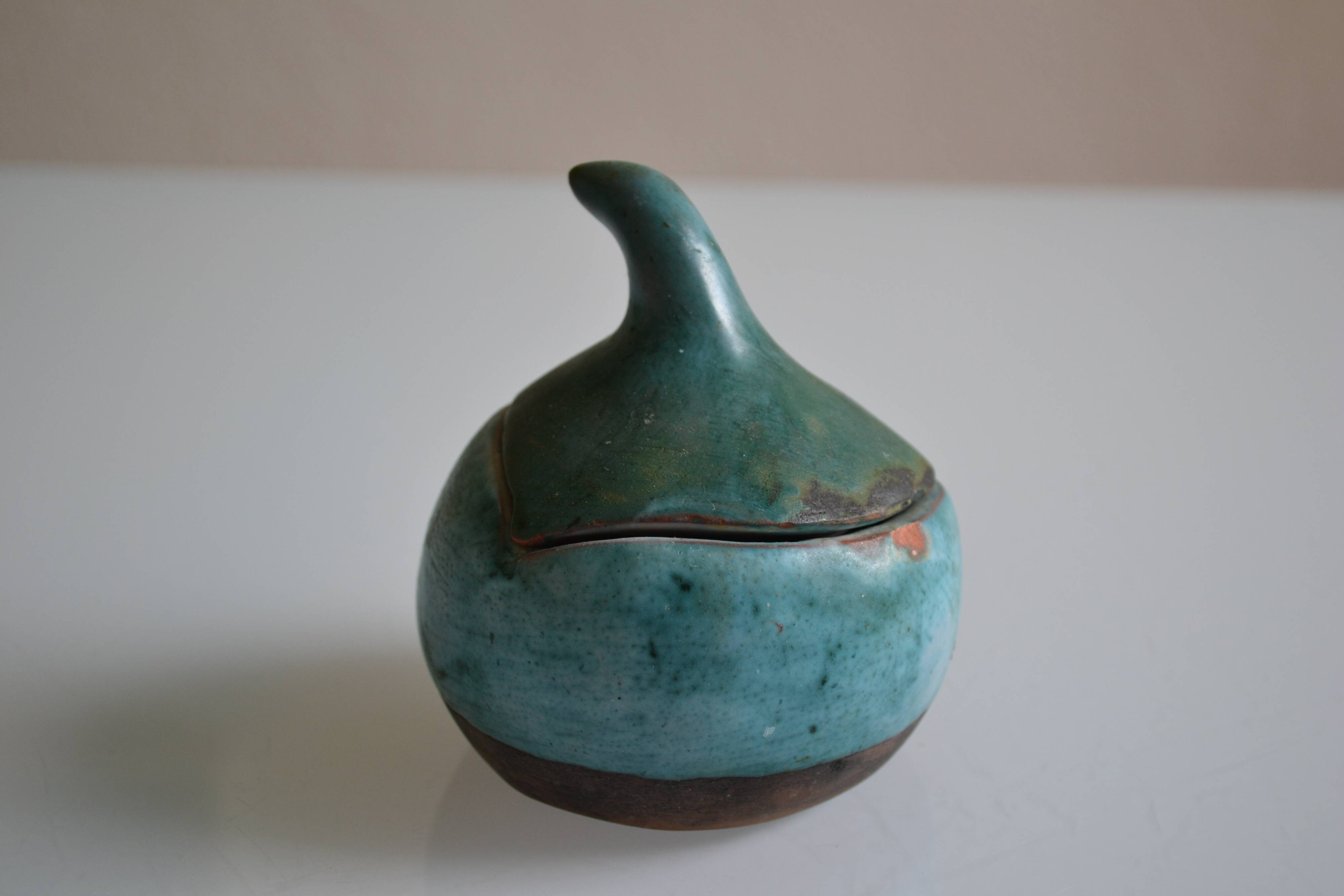 Signature ceramic fish-covered pot to identify.
