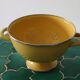 Old yellow enameled colander