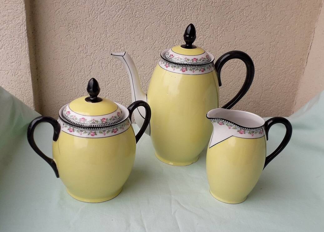 Coffee pot or teapot, sugar bowl and milk jug in porcelain.