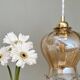 Vintage globe suspension in slightly pearly amber glass