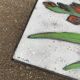 Vintage rectangular coffee table with ceramic inlaid flowers and steel.