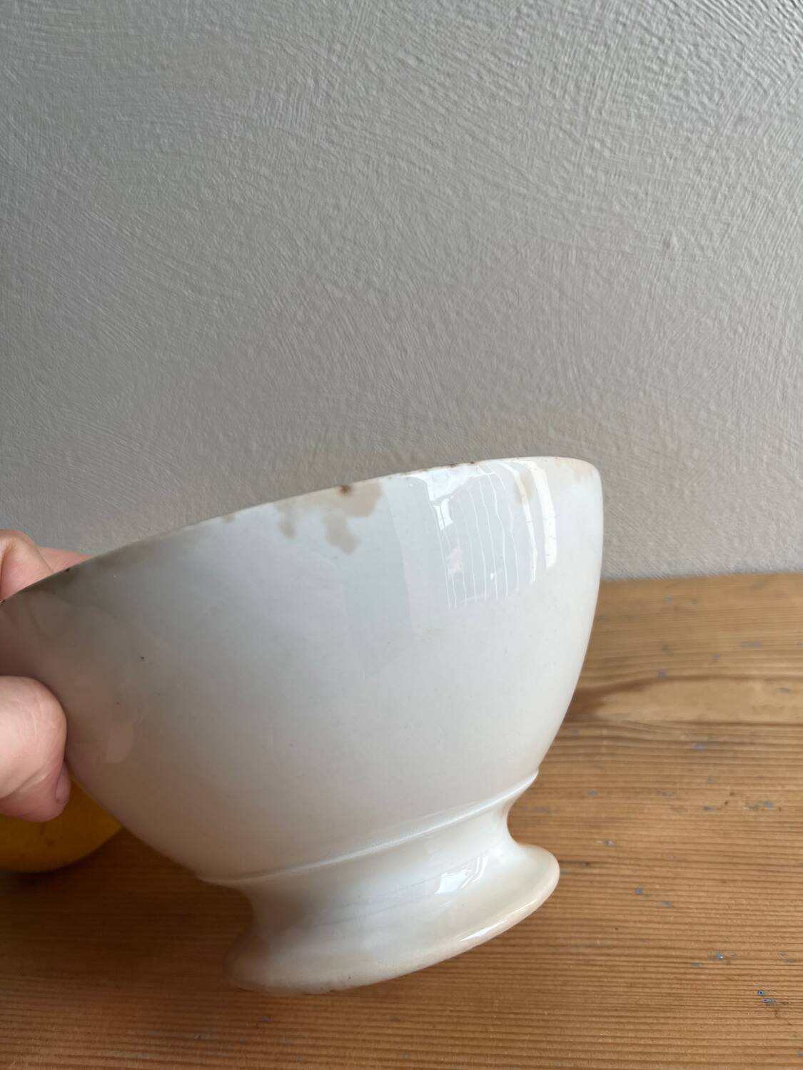 Old earthenware bowl on a pedestal, Badonviller, France.