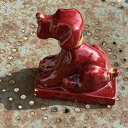Dog sign CAB in vintage burgundy red enameled ceramic slip, art deco
