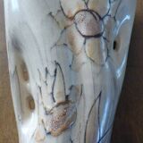 Beige colored vase from the vallauris brand with flower pattern