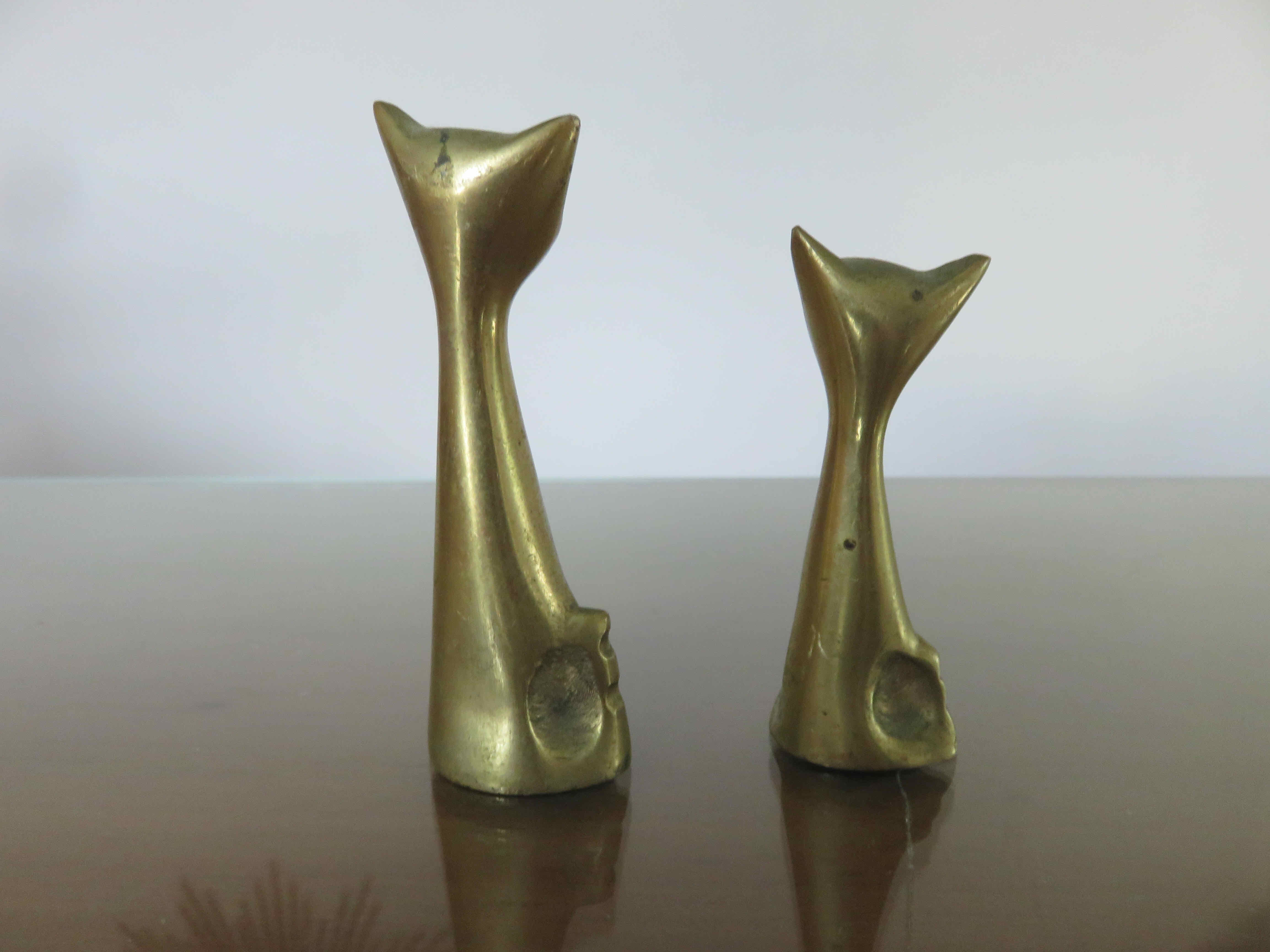 Couple of stylized cats in brass 70s