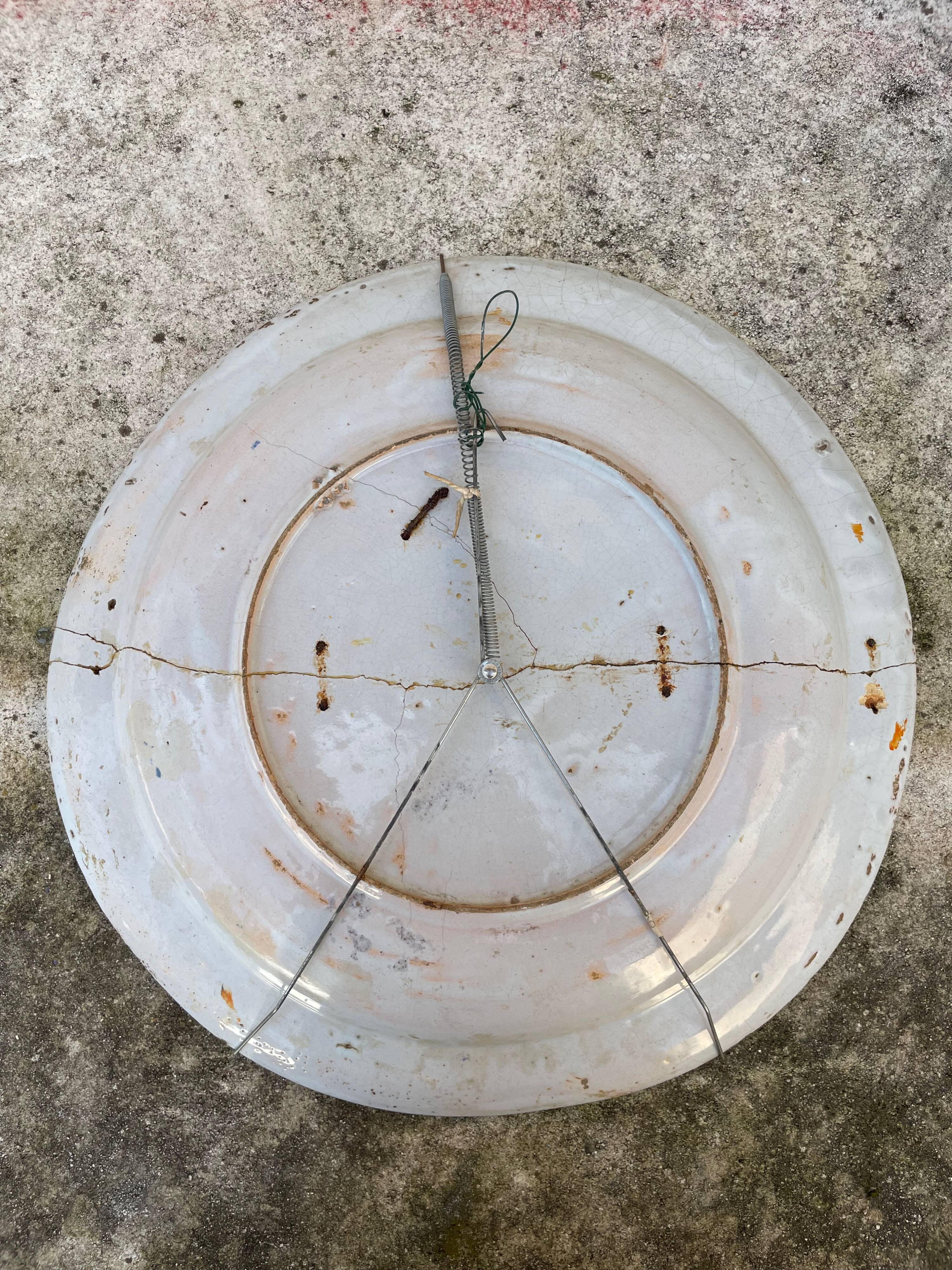 Restored antique dish with floral motif