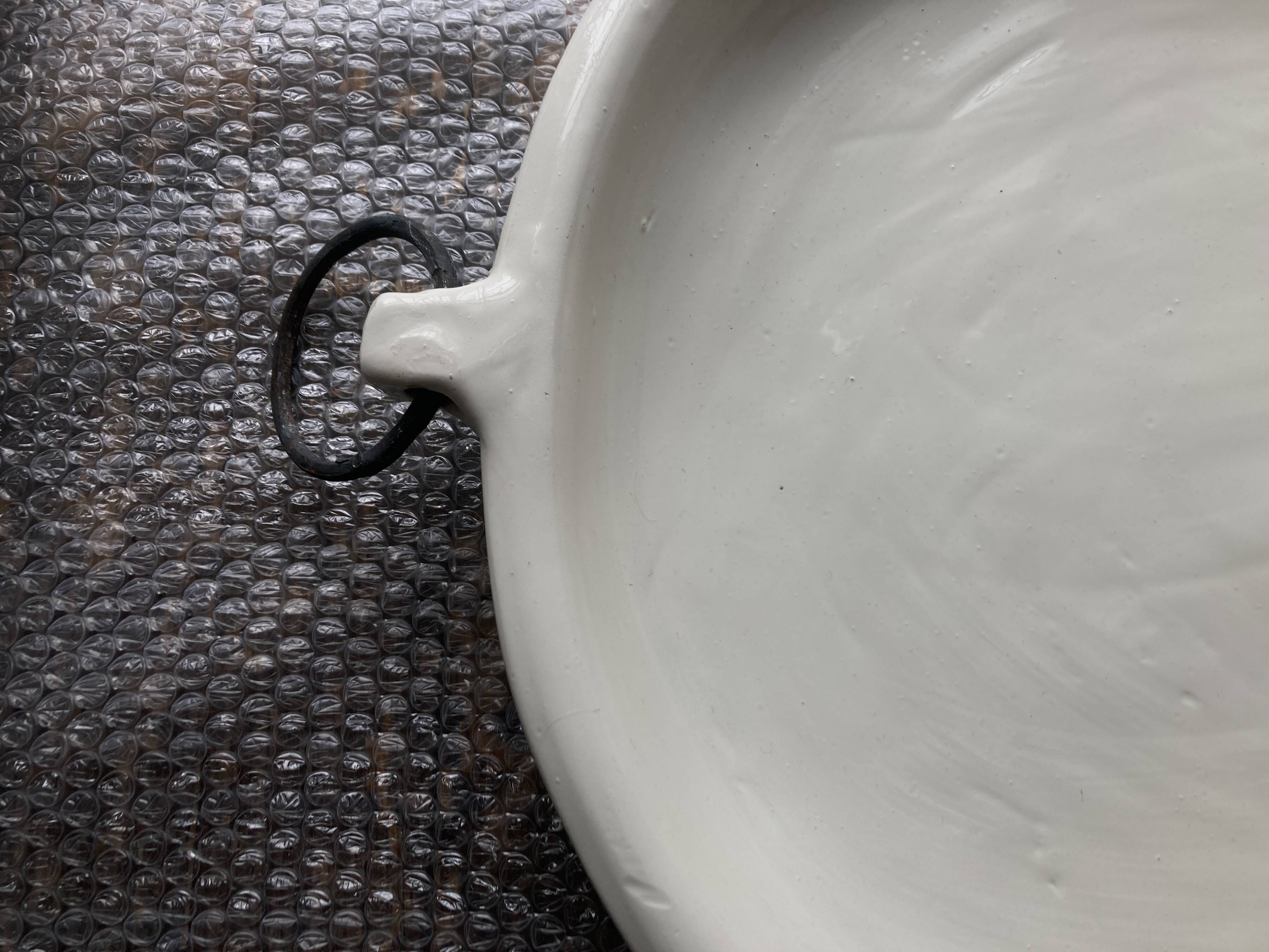XXXL flat centerpiece in glazed earthenware with wrought iron rings.