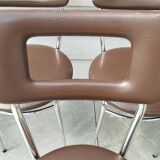 3 Chaises en skaï marron chocolat des années 1960-1970, estampillées.