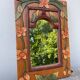 Miroir en bois, sculpté à décor de fleurs
