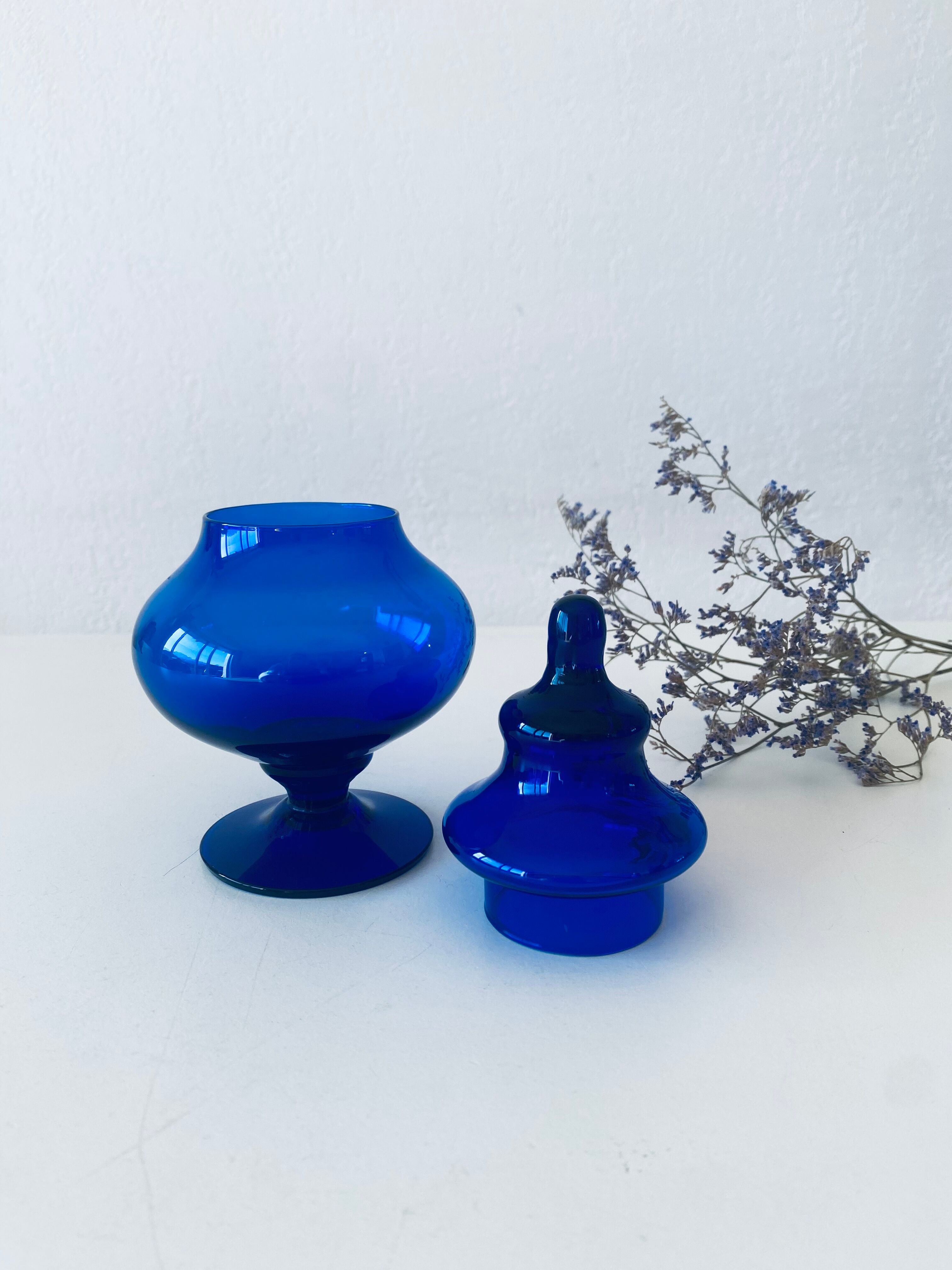 Blue glass apothecary shaped bottle